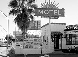 In an effort to attract customers, older motels such as this urban Arizona establishment offer rock-bottom prices for longer term guests, essentially creating low-income housing.